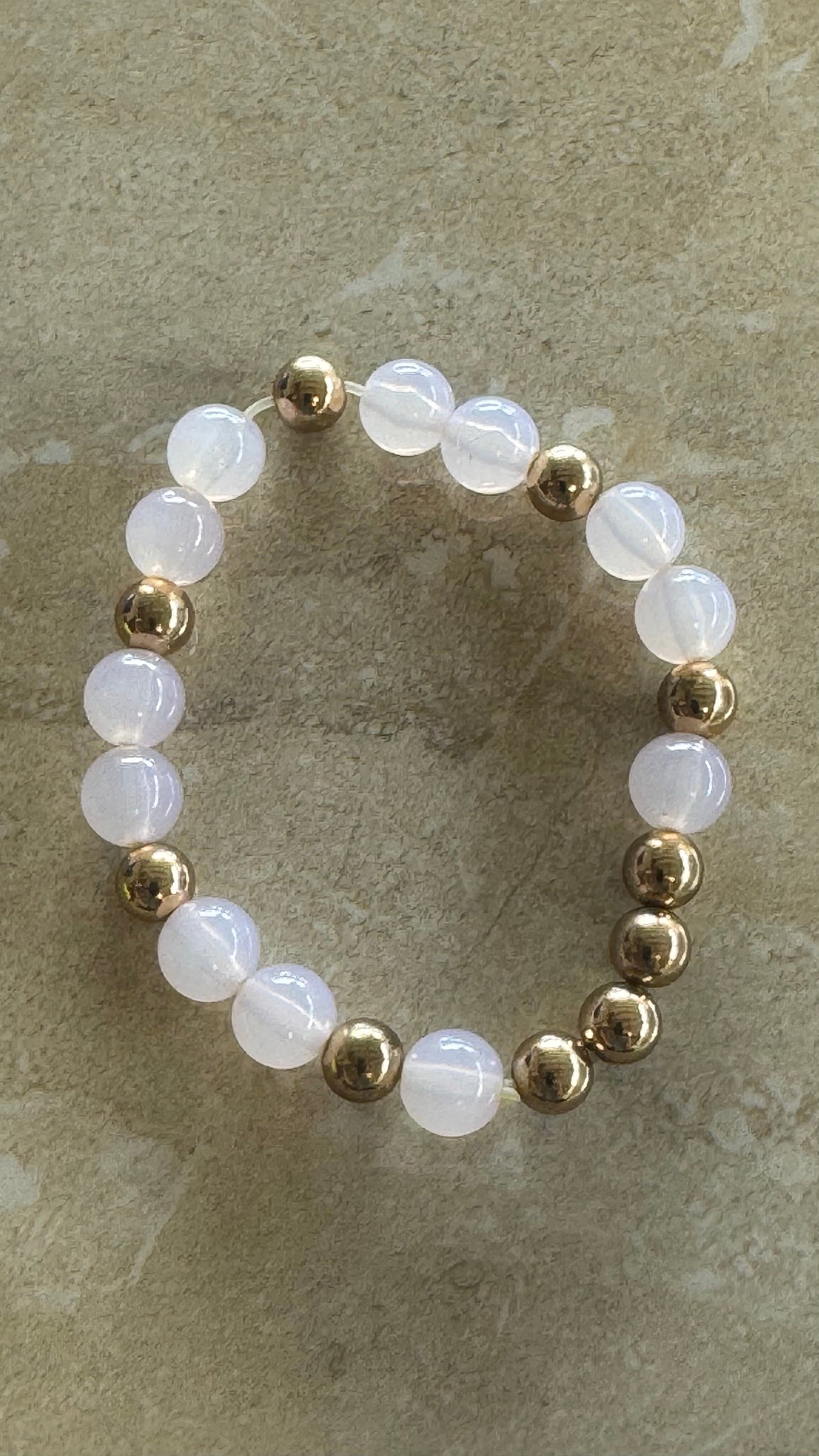 Multi beaded white a gold flex bracelet 2(1/3)” diameter
