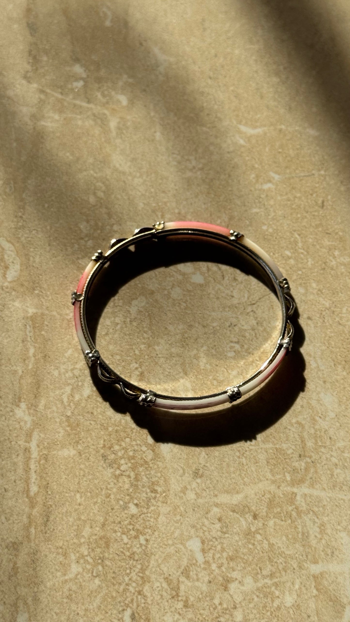 Silver bangle cuff bracelet with red and white accents 2(1/2)” diameter
