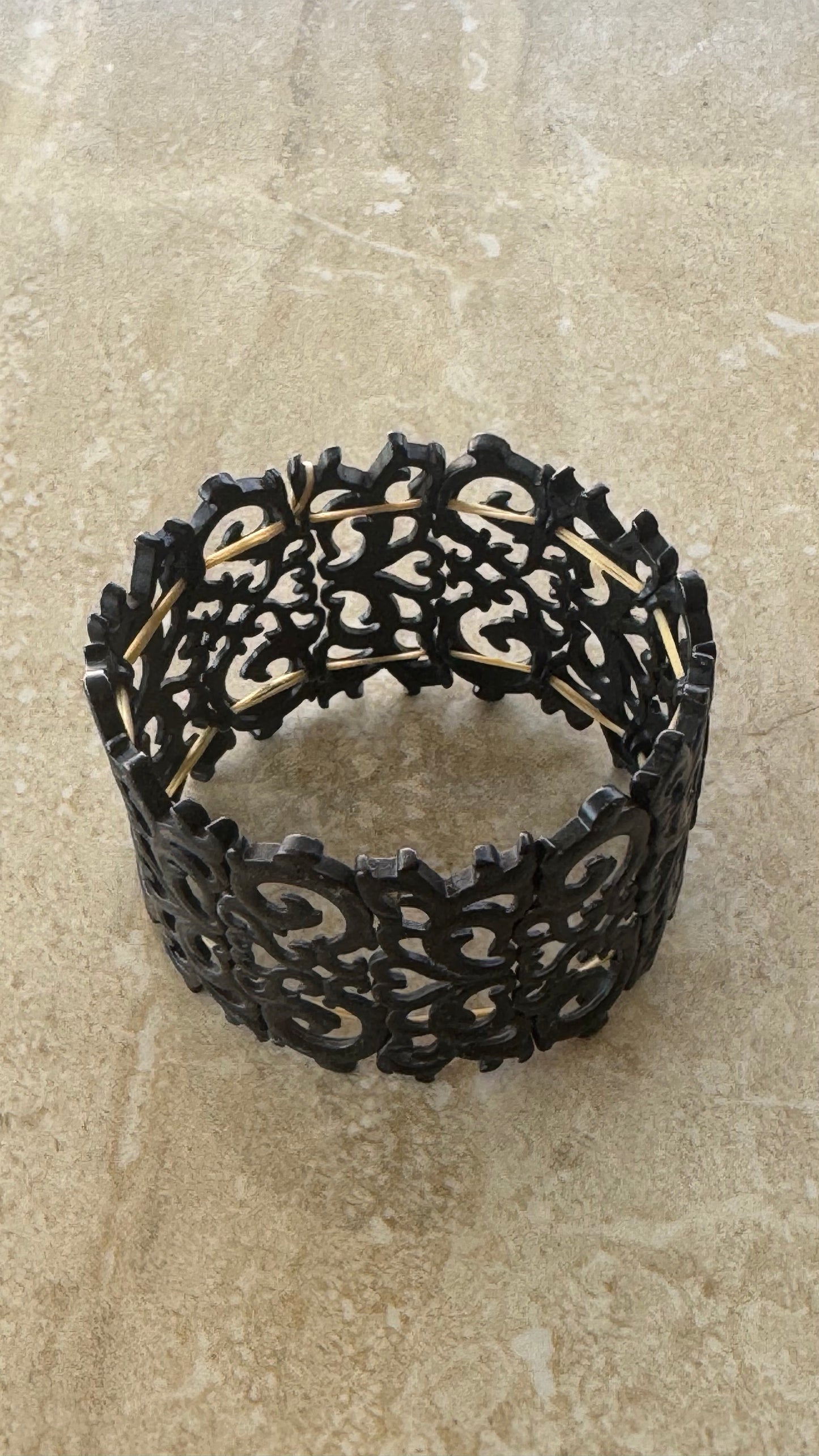 Artisanal Black Carved Openwork Stretch Cuff Bracelet with Gold-Toned Hardware