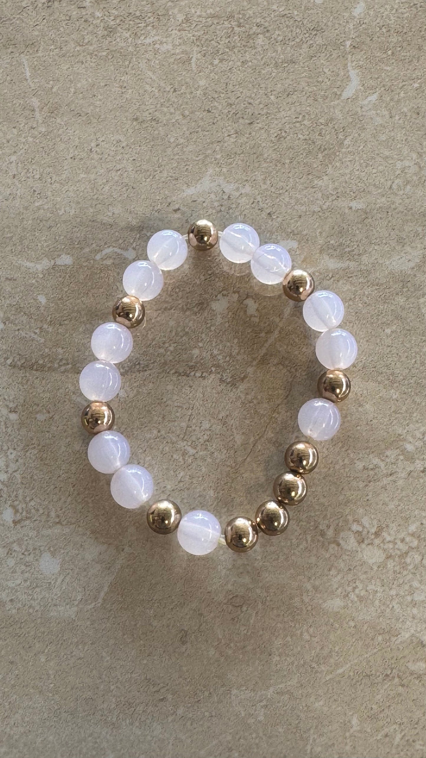 Multi beaded white a gold flex bracelet 2(1/3)” diameter