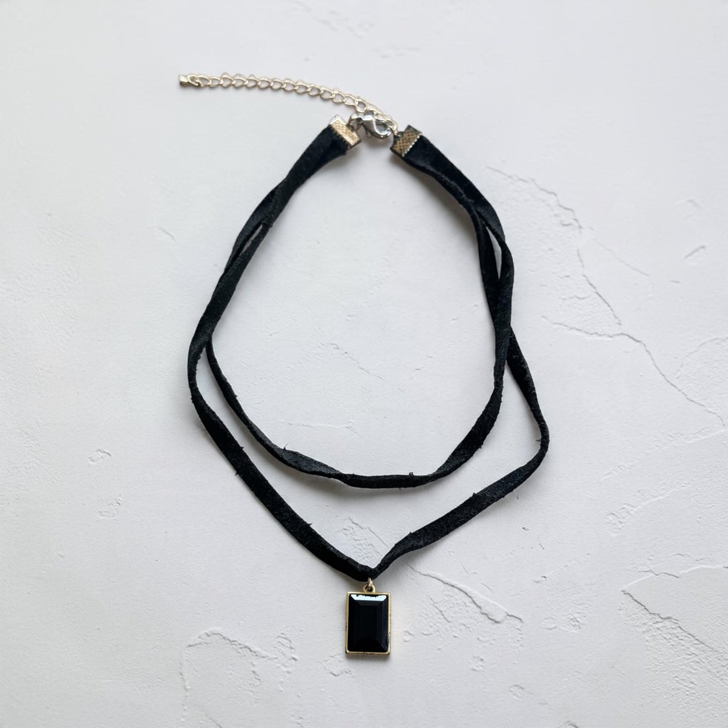 Black double string necklace with black rectangular pendant 14” length 2(1/2)” ext.