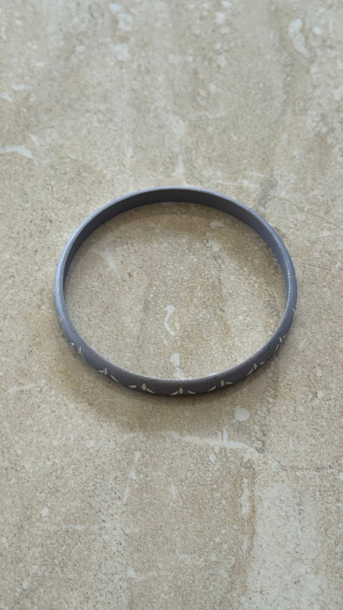 matte grey engraved metal bangle bracelet 2(1/2)” diameter